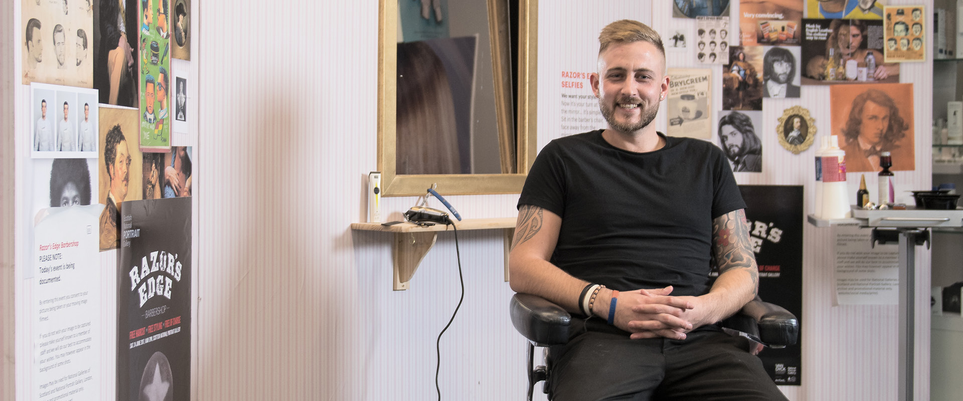 Barbering student sitting in the barbershop salon.