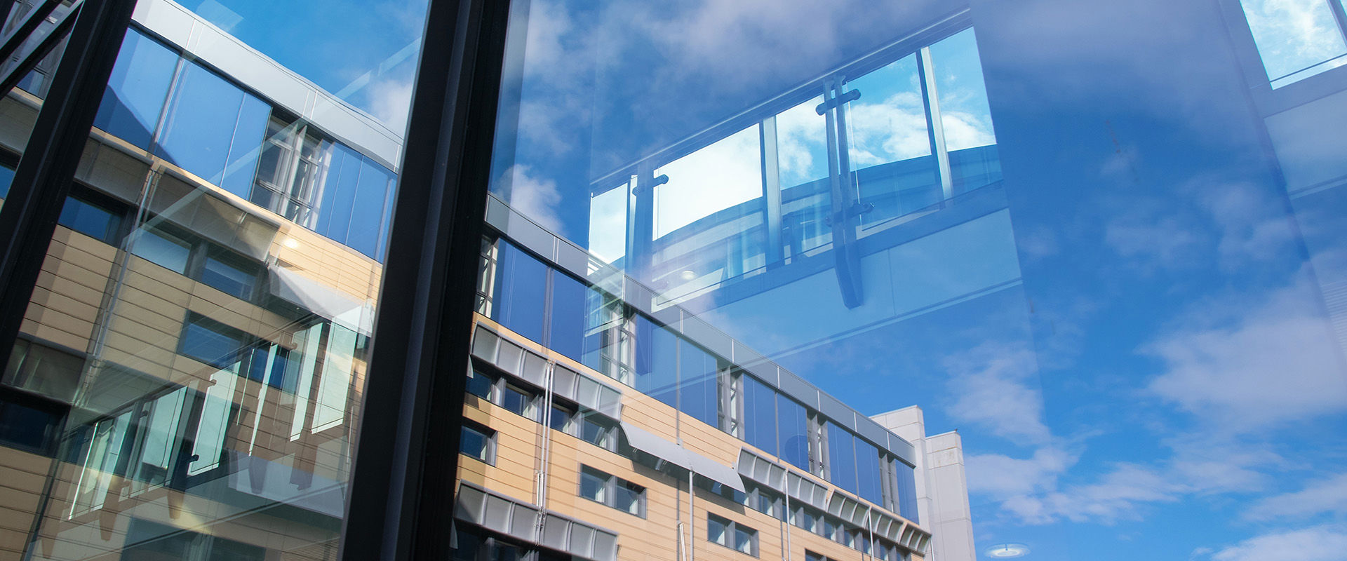 Looking out a window to Granton campus building.